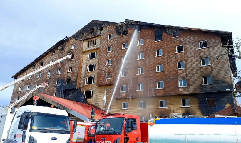 Firefighters work to extinguish a fire at a hotel in the ski resort of Kartalkaya in Bolu province, Turkey - Reuters