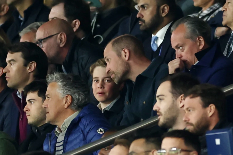           Prince William and his son Prince George in the stands - REUTERS     