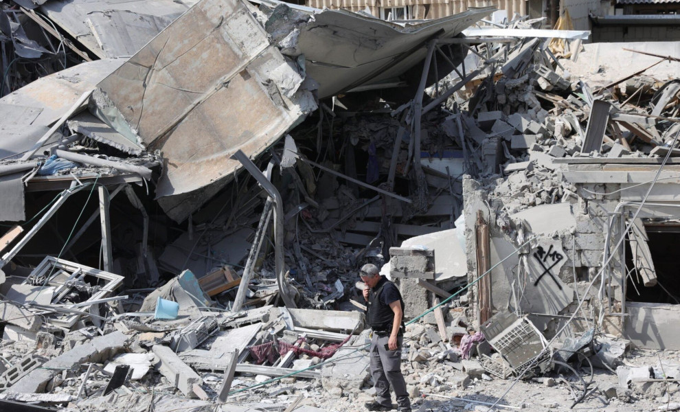 epa10906897 Police at the scene of a destroyed building in Tel Aviv, Israel, 08 October 2023, following overnight Hamas rocket attacks. Rocket barrages were launched from the Gaza Strip as of early 07 October in a surprise attack claimed by the Islamist m