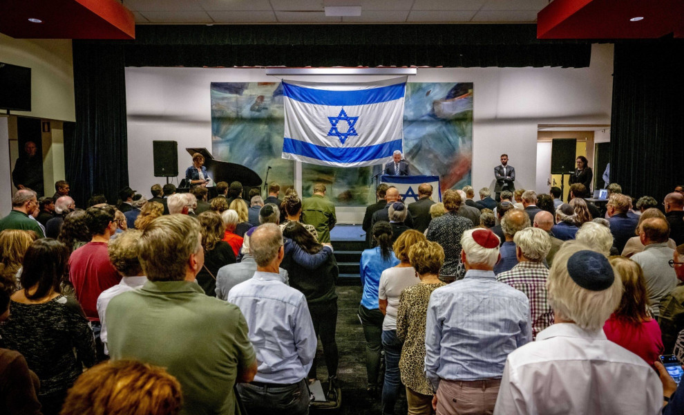 epa10908314 Israel's Ambassador to the Netherlands Modi Ephraim (rear C) speaks during the Together for Israel meeting at the Jewish Cultural Center (JCC) in Amsterdam, the Netherlands, 08 October 2023. Various organizations came together to discuss the l