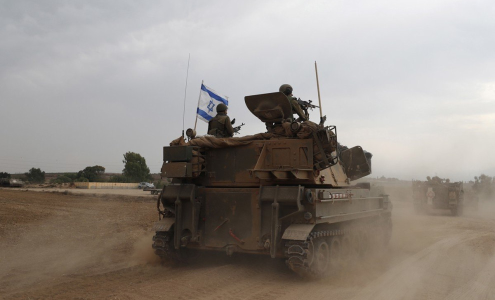 epaselect epa10909875 Israeli soldiers on military vehicles maneuver at an area along the border with Gaza, southern Israel, 09 October 2023. Israeli chief military spokesperson Rear-Admiral Daniel Hagari said on 09 October that the country had drafted a 
