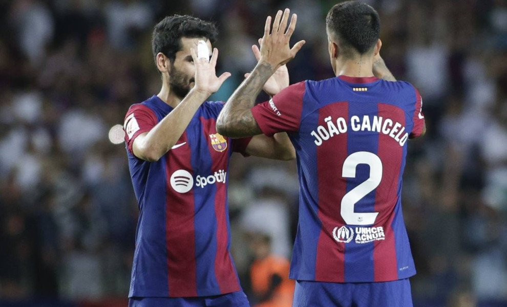 epa10879441 FC Barcelona's midfielder Ilkay Gundogan (L) and defender Joao Cancelo (R) celebrate their victory following the Spanish LaLiga soccer match between FC Barcelona and RC Celta Vigo, in Barcelona, Spain, 23 September 2023.  EPA/Quique García