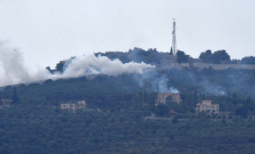 epa10913223 Smoke rises from positions on a hill after Israeli shelling on the outskirts of Dhayra village, near the Lebanese-Israeli border, Lebanon, 11 October 2023. Hezbollah said on 11 October it fired missiles on Israel, two days after three of its m