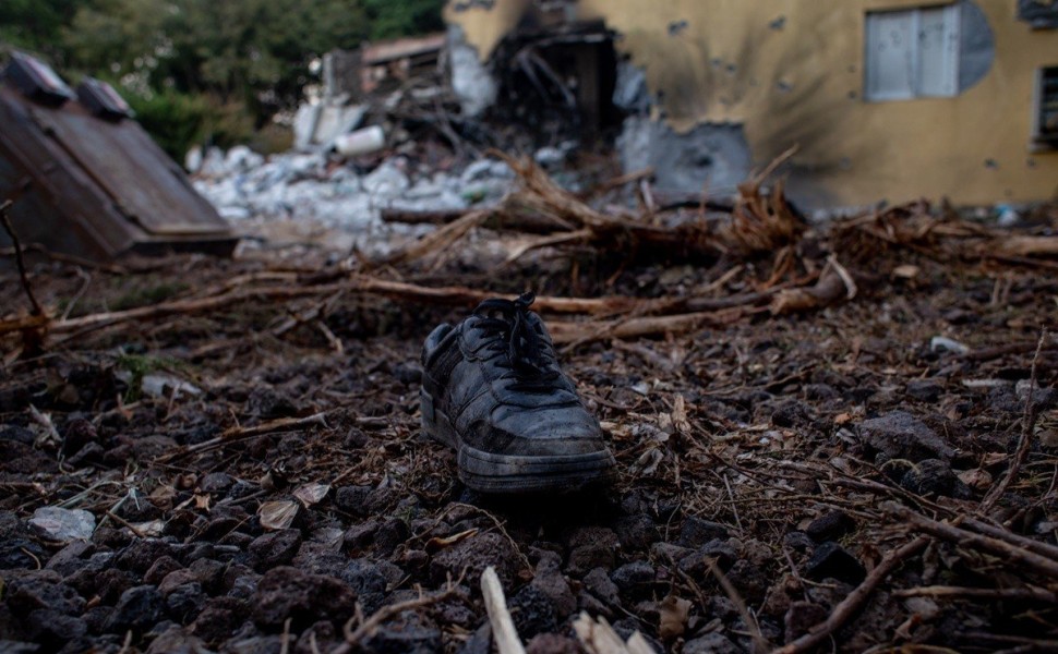 epa10913890 A boot lies on the ground outside a damaged house in Be'eri, Israel, 11 October 2023. According to Israeli officials, 108 Israeli bodies were found in the Be'eri kibbutz, near the Gaza border, following Hamas attack on 07 October. More than 1, epa10913890 A boot lies on the ground outside a damaged house in Be'eri, Israel, 11 October 2023. According to Israeli officials, 108 Israeli bodies were found in the Be'eri kibbutz, near the Gaza border, following Hamas attack on 07 October. More than 1,