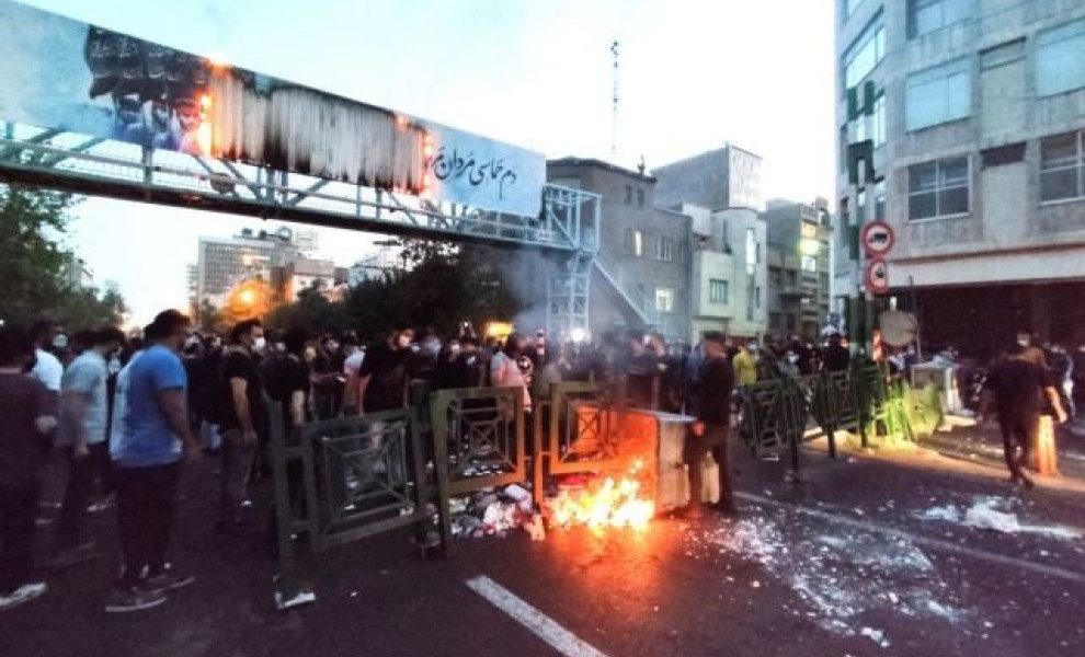 FILE PHOTO: People light a fire during a protest over the death of Mahsa Amini, a woman who died after being arrested by the Islamic republic's "morality police", in Tehran, Iran September 21, 2022. WANA (West Asia News Agency) via REUTERS ATTENTION EDITO