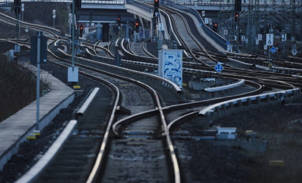 Railroad signals turned to red near the tracks in Berlin, Germany, Monday, March 27, 2023, during a national wide public transport strike. An increased number of travelers in Germany boarded trains and planes on Sunday before the one-day strike that start
