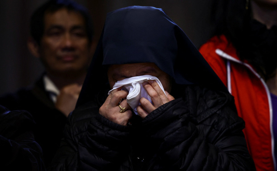 A nun reacts as Pope Francis lies in state in St. Peter's Basilica, at the Vatican - Reuters